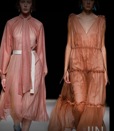 Two models in blush and rust-toned draped gowns