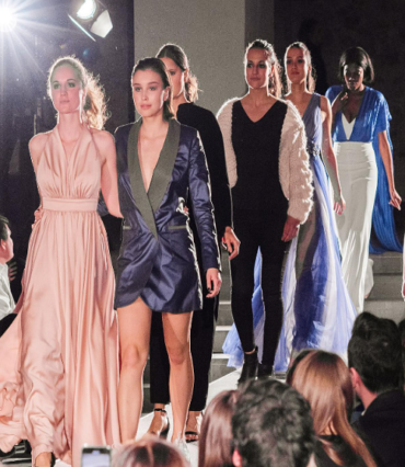 Group of models descending stairs in evening looks