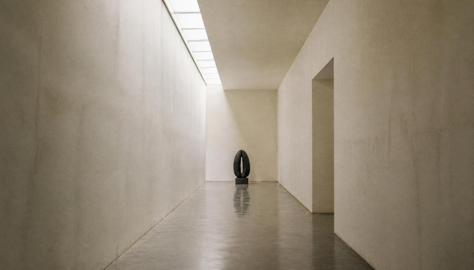 A quiet gallery corridor in afternoon light